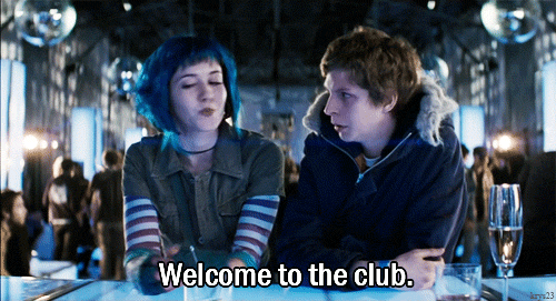 GIF of a movie character saying "Welcome to the club!" inside of a club, from the movie "Scott Pilgrim vs. The World"